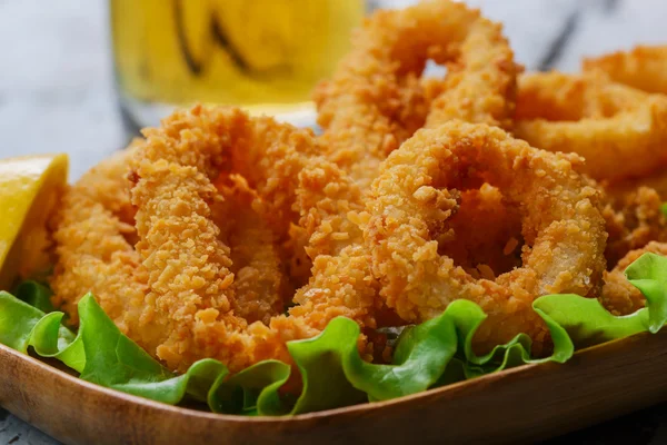 Fried squid rings breaded with lemon — Stock fotografie